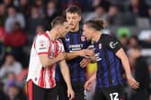Taylor Harwood-Bellis & Luke Ayling argue during the play-off semi-finals.