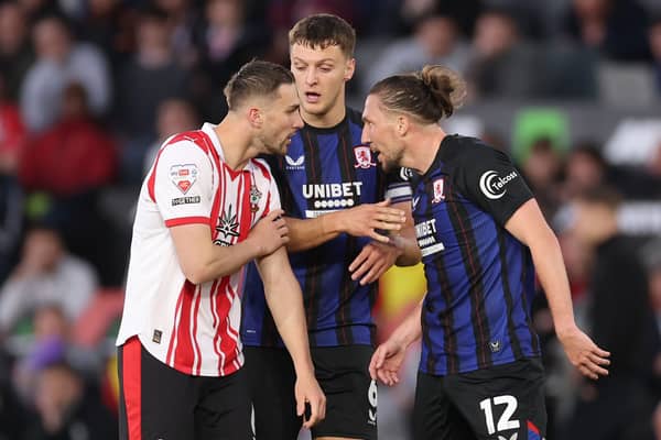 Taylor Harwood-Bellis & Luke Ayling argue during the play-off semi-finals.