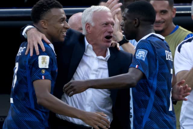 Didier Deschamps celebrates the win over Sweden with his players