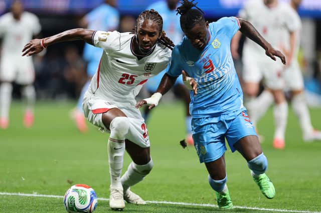 Djed Spence battles for the ball with Congolese goalscorer Brian Cipenga