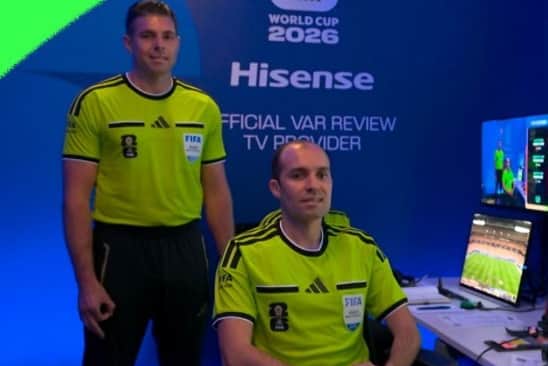 The offending hand gesture made by VAR assistant Shaun Evans (left)