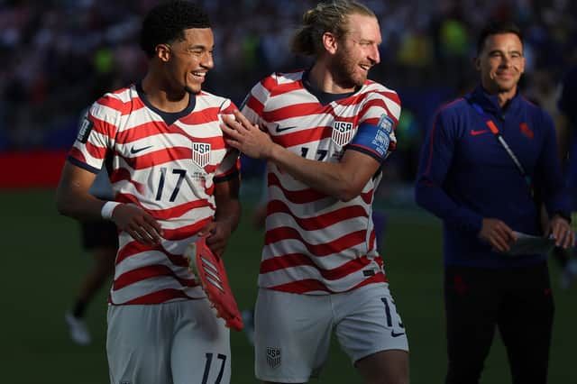 Malik Tillman and Tim Ream celebrate the USMNT's victory over Bosnia & Herzegovina