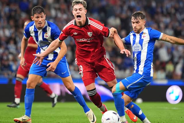 Robbie Ure (centre) in action for new side Sevilla