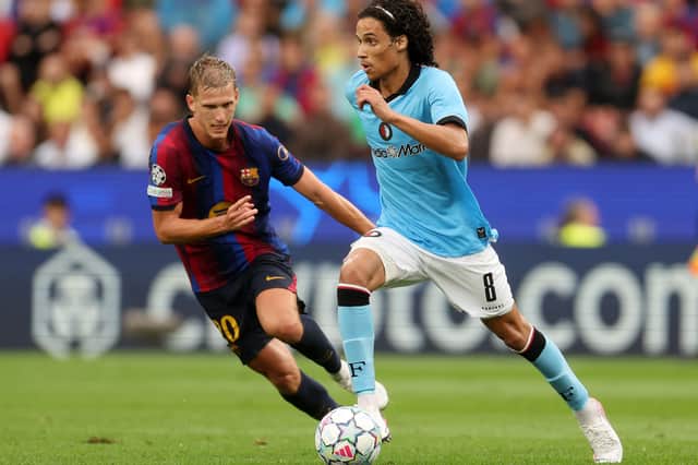 Zechiël (right) in action against Barcelona at the Camp Nou