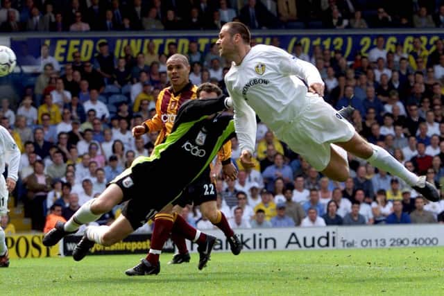 Mark Viduka heads home to open the scoring.