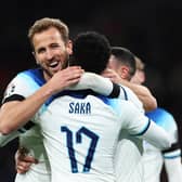 Harry Kane of England (L) celebrates with teammates Bukayo Saka (C) and Phil Foden after scoring during England's Euro 2024 qualifying campaign (Picture: Catherine Ivill/Getty Images)