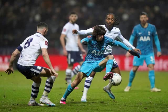 Tottenham Hotspur's Bryan Gil (centre) battles with Preston North End's Daniel Johnson (right) during the Emirates FA Cup fourth round match at Deepdale Stadium. Tim Goode/PA Wire.