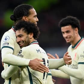 Mohamed Salah of Liverpool celebrates after scoring their side's fourth goal with Virgil van Dijk during the Premier League match between Manchester United and Liverpool at Old Trafford on October 24, 2021 in Manchester, England. (Photo by Michael Regan/Getty Images)