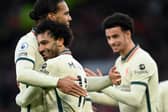 Mohamed Salah of Liverpool celebrates after scoring their side's fourth goal with Virgil van Dijk during the Premier League match between Manchester United and Liverpool at Old Trafford on October 24, 2021 in Manchester, England. (Photo by Michael Regan/Getty Images)