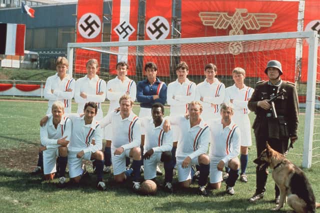 With the Escape to Victory boys. Wark loved Michael Caine's movie tales, called Pele "Eddie", played chess with Ossie Ardiles but thought Sylvester Stallone a "big shot"