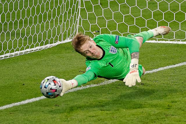 England's goalkeeper Jordan Pickford saves a penalty during the UEFA EURO 2020 final football match between Italy and England at the Wembley Stadium in London on July 11, 2021. (Photo by JOHN SIBLEY / POOL / AFP) (Photo by JOHN SIBLEY/POOL/AFP via Getty Images)