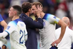 TIME NEEDED: England boss Gareth Southgate consoles Harry Kane after Saturday night's 2-1 defeat to France in the Qatar World Cup quarter-finals. 
Photo by Julian Finney/Getty Images.