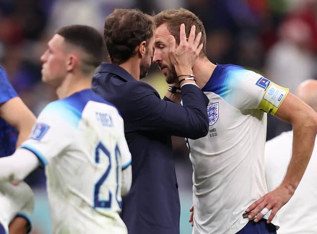 TIME NEEDED: England boss Gareth Southgate consoles Harry Kane after Saturday night's 2-1 defeat to France in the Qatar World Cup quarter-finals. 
Photo by Julian Finney/Getty Images.