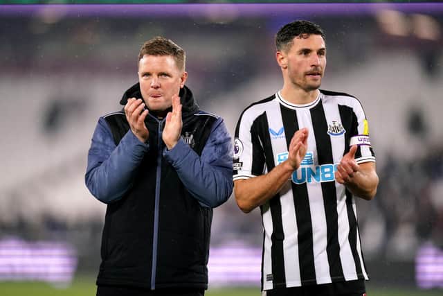 Newcastle United head coach Eddie Howe and defender Fabian Schar applaud fans at the London Stadium.