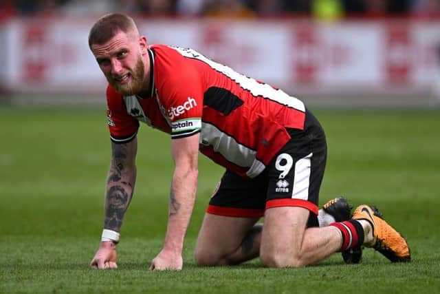 ON HIS KNEES: Sheffield United's stand-in captain Oli McBurnie