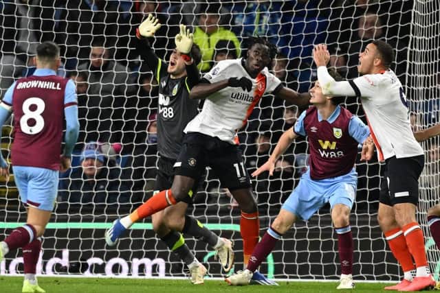 Burnley keeper James Trafford and Town forward Elijah Adebayo collide as Carlton Morris's header was allowed to stand during Luton's 1-1 draw at Burnley last Friday - pic: OLI SCARFF/AFP via Getty Images