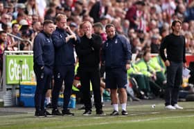 BLOWS: From Nottingham Forest boss Steve Cooper, centre, and his team during Saturday's 2-1 defeat at Brentford. Photo by Ryan Pierse/Getty Images.