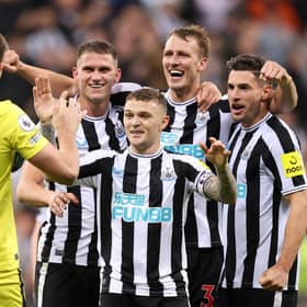 NEWCASTLE UPON TYNE, ENGLAND - OCTOBER 19: Nick Pope of Newcastle United joins in with the celebrations as team mates Sven Botman, Kieran Trippier, Dan Burn and Fabian Schar celebrates their side's win after the final whistle of the Premier League match between Newcastle United and Everton FC at St. James Park on October 19, 2022 in Newcastle upon Tyne, England. (Photo by George Wood/Getty Images)