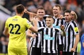NEWCASTLE UPON TYNE, ENGLAND - OCTOBER 19: Nick Pope of Newcastle United joins in with the celebrations as team mates Sven Botman, Kieran Trippier, Dan Burn and Fabian Schar celebrates their side's win after the final whistle of the Premier League match between Newcastle United and Everton FC at St. James Park on October 19, 2022 in Newcastle upon Tyne, England. (Photo by George Wood/Getty Images)