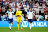 England's John Stones, goalkeeper Jordan Pickford and Declan Rice during the FIFA World Cup Quarter-Final match at the Al Bayt Stadium in Al Khor, Qatar. Picture: Nick Potts/PA Wire.