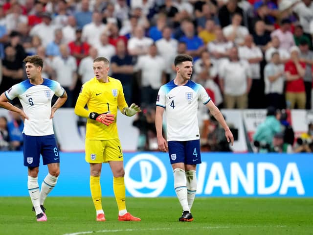 England's John Stones, goalkeeper Jordan Pickford and Declan Rice during the FIFA World Cup Quarter-Final match at the Al Bayt Stadium in Al Khor, Qatar. Picture: Nick Potts/PA Wire.