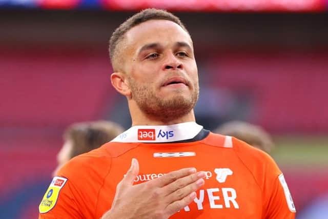 Luton forward Carlton Morris shows his support for team-mate Tom Lockyer