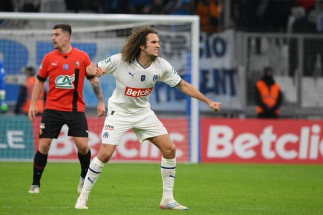 Marseille's French midfielder Matteo Guendouzi (R) celebrates after winning the French Cup round of 32 football match between Olympique de Marseille (OM) and Stade Rennais FC at the Stade Velodrome in Marseille, southern France on January 20, 2023. (Photo by Nicolas TUCAT / AFP) (Photo by NICOLAS TUCAT/AFP via Getty Images)