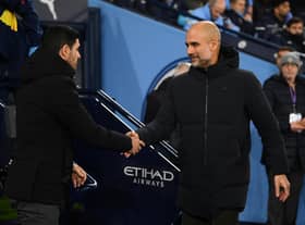 MANCHESTER, ENGLAND - JANUARY 27: Mikel Arteta, Manager of Arsenal, shakes hands with Pep Guardiola, Manager of Manchester City, prior to the Emirates FA Cup Fourth Round match between Manchester City and Arsenal at Etihad Stadium on January 27, 2023 in Manchester, England. (Photo by Michael Regan/Getty Images)
